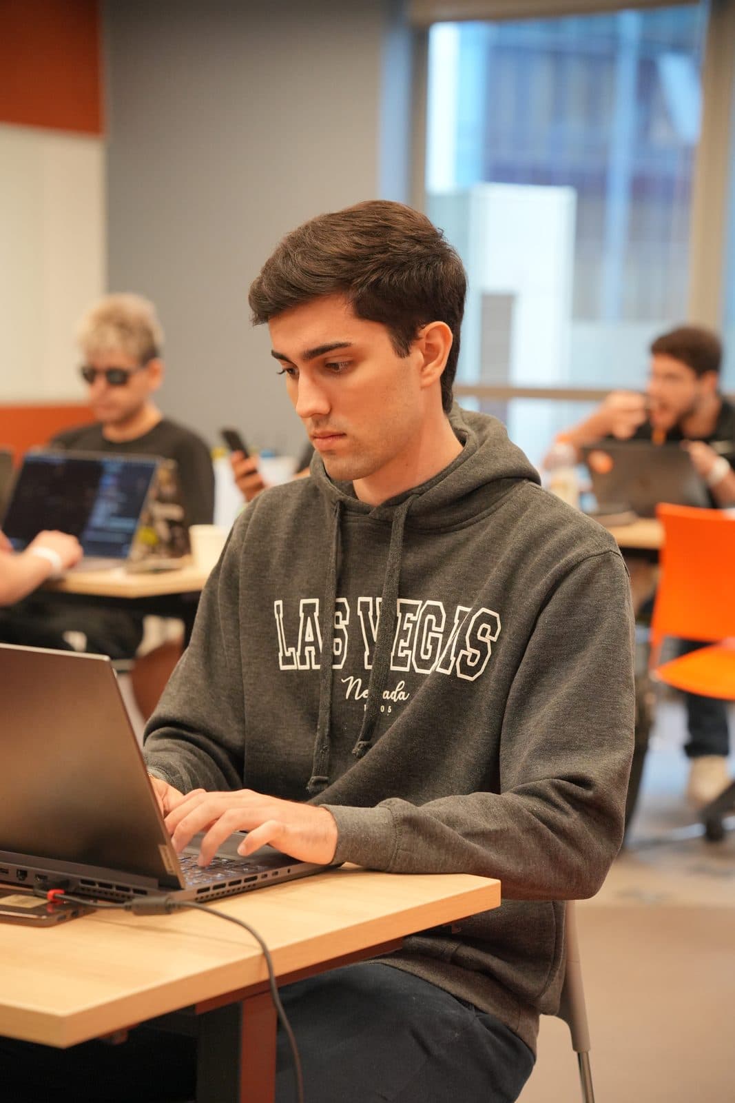 Me working on my laptop at a shared table